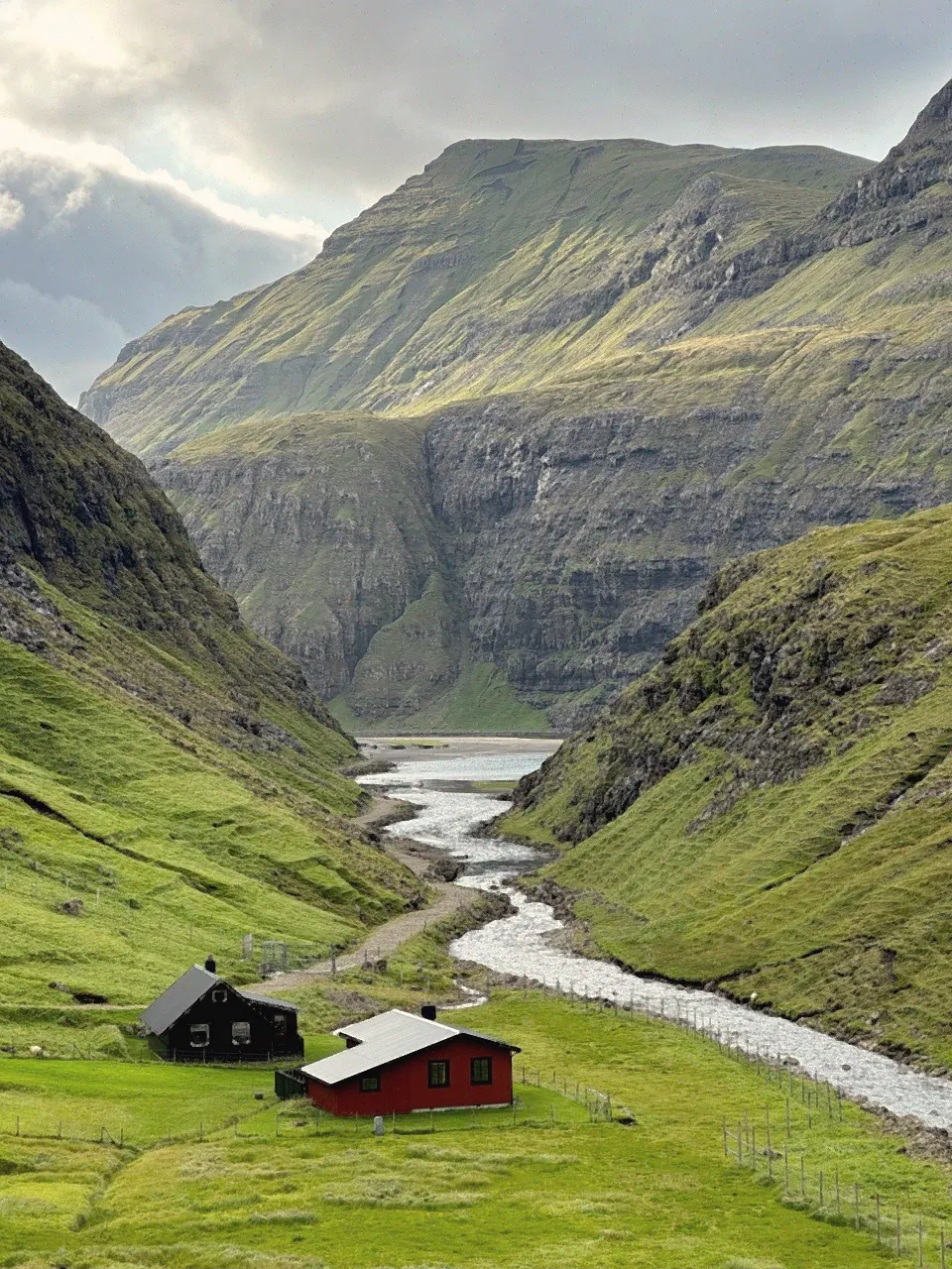 Green valley and mountain landscape under soft light