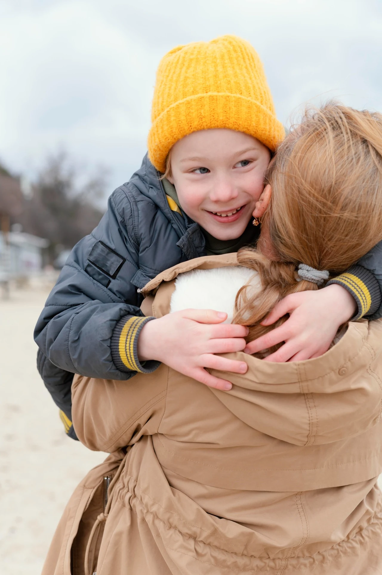 Child sharing a warm hug with a trusted adult