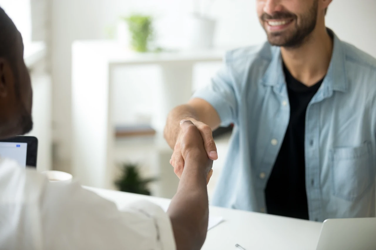 Two professionals shaking hands after a constructive discussion